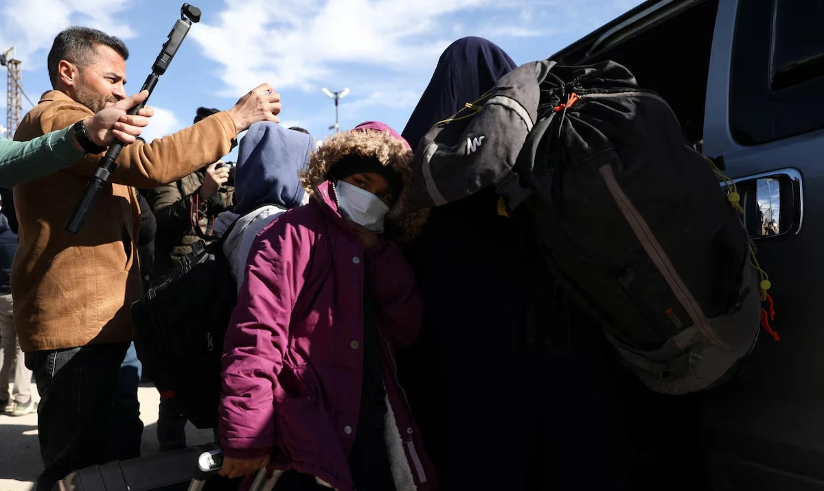 Members of Australian families believed to be linked to the Daesh militants leave Roj camp near Derik, Syria. (Reuters)