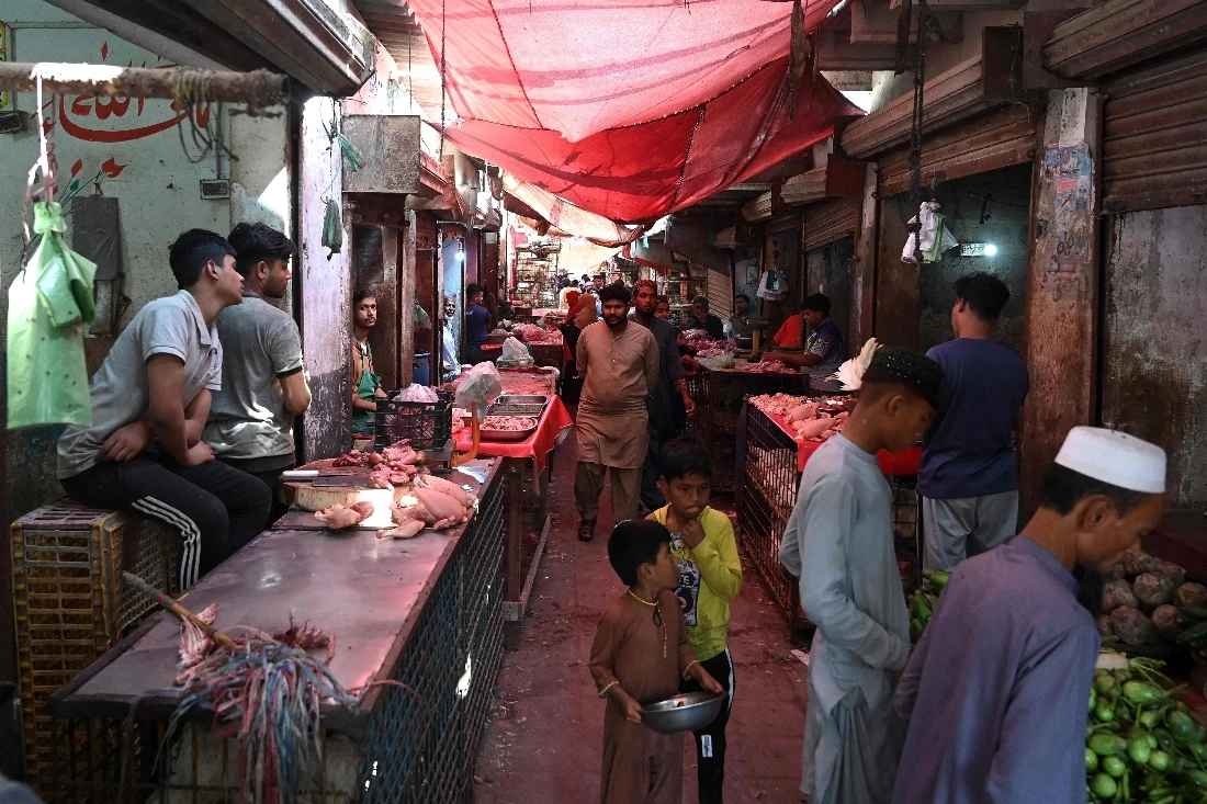 Pakistani-Bengalis shopping at a wet market in Karachi, Pakistan. (AFP)