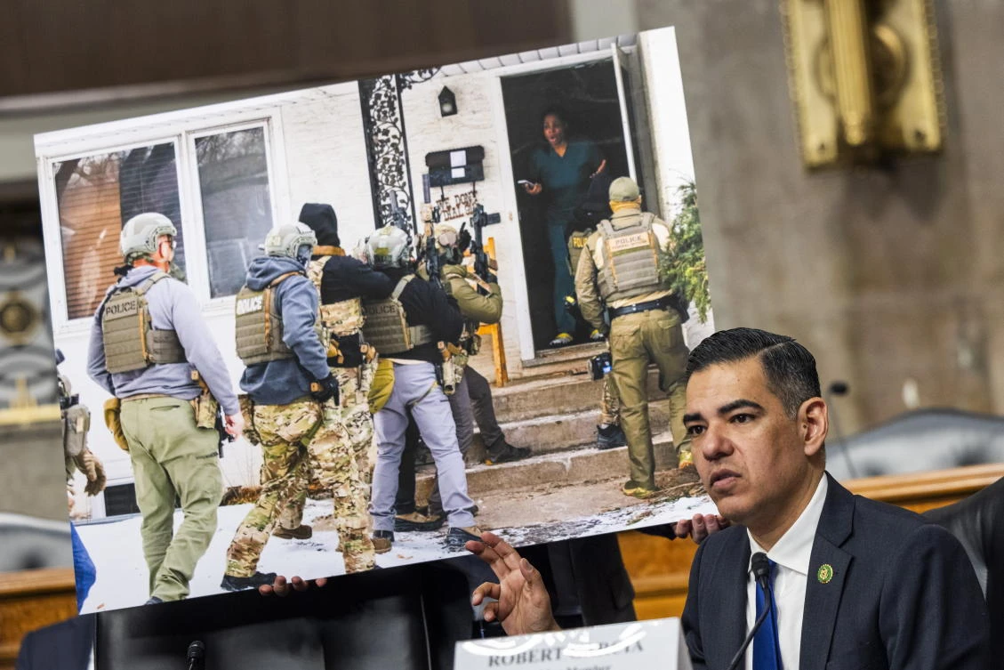 California Representative Robert Garcia (R) speaks before a picture of Teyana Gibson Brown (C) as Immigration and Customs Enforcement (ICE) agents raid her house during a bicameral public forum on 'constitutional violations and abuses by ICE' in the Dirksen Senate Office Building in Washington, DC, USA, 23 February 2026.
