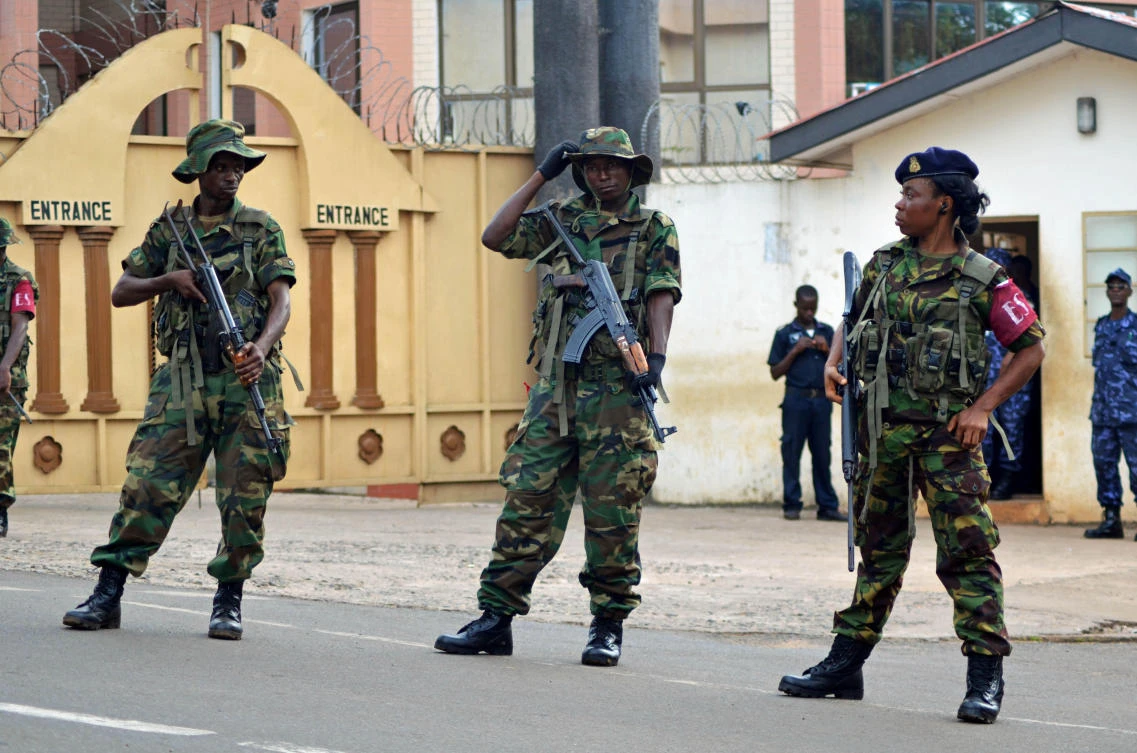 Soldiers stand guard in Freetown, Sierra Leone, Nov. 23, 2012. (AP Photo/Tommy Trenchard, File)