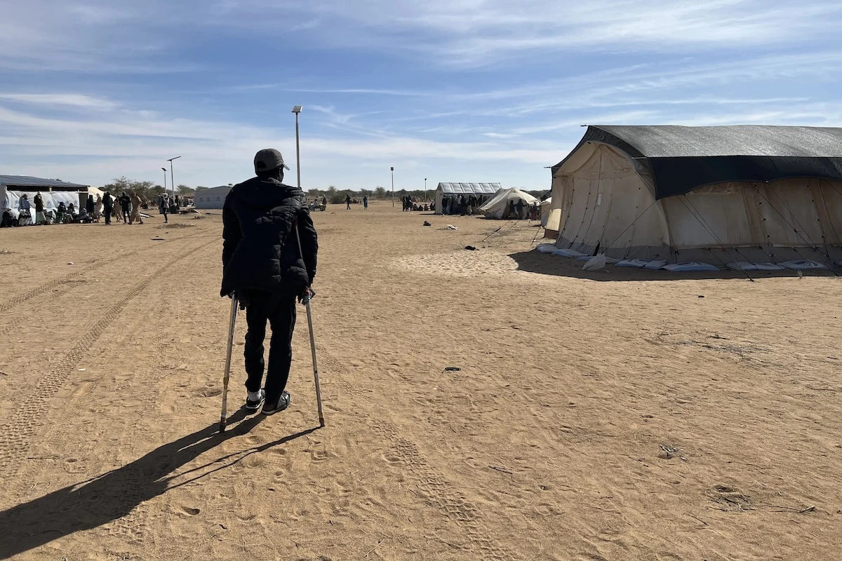 A 22-year-old man shot in the foot by the RSF but survived mass killings in El-Fasher, is a refugee in eastern Chad. HRW says the RSF targeted people with disabilities during the attack. (Human Rights Watch)