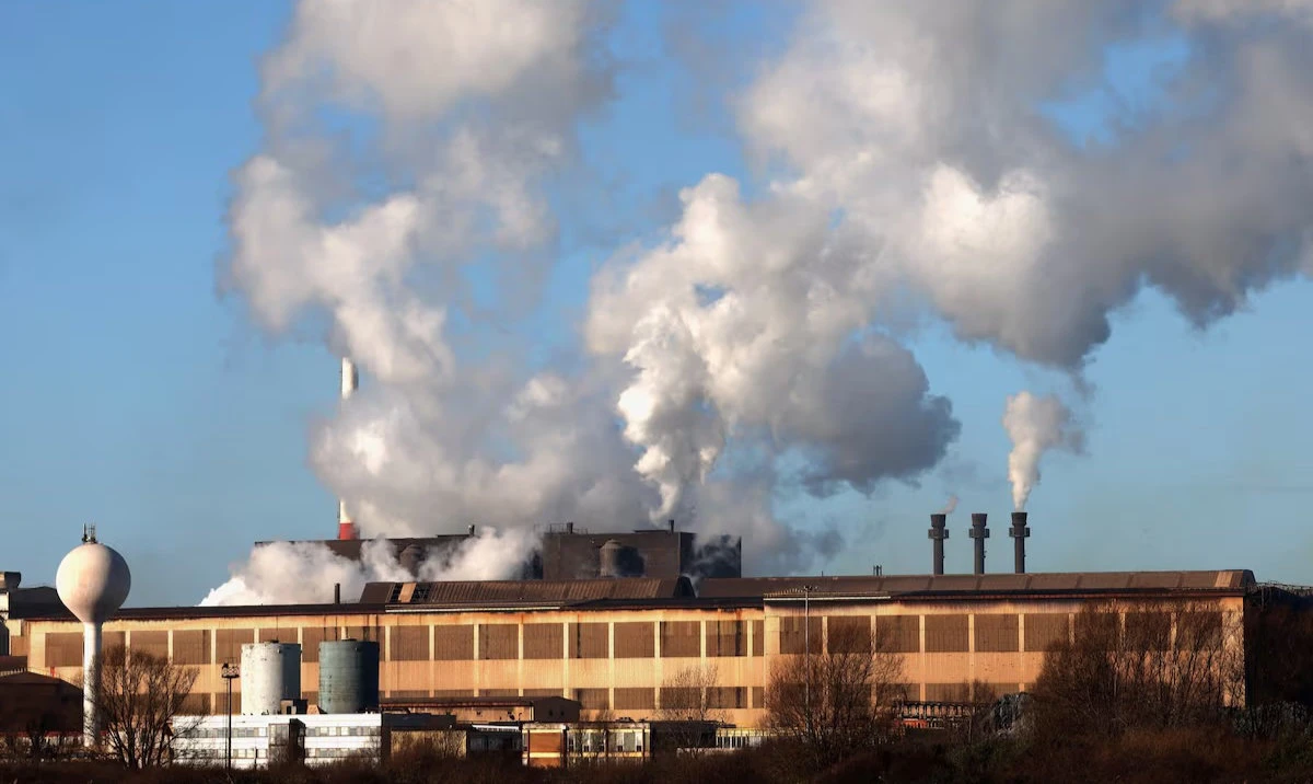 Smoke rises from chimneys at a factory in the port of Dunkirk, France. (Reuters)