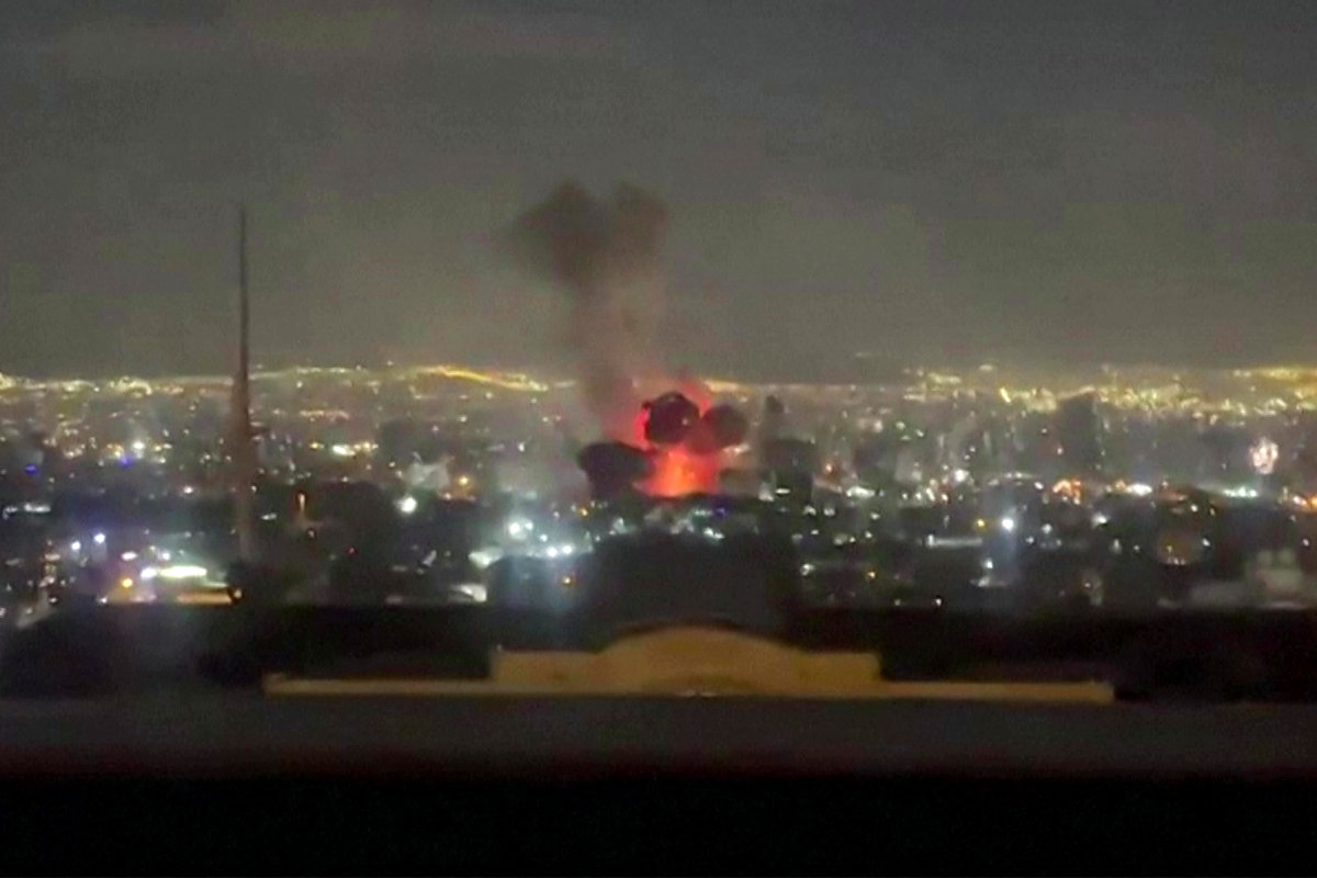This video grab posted on social media on March 1, 2026 shows an explosion following a strike on Tehran. (AFP)
