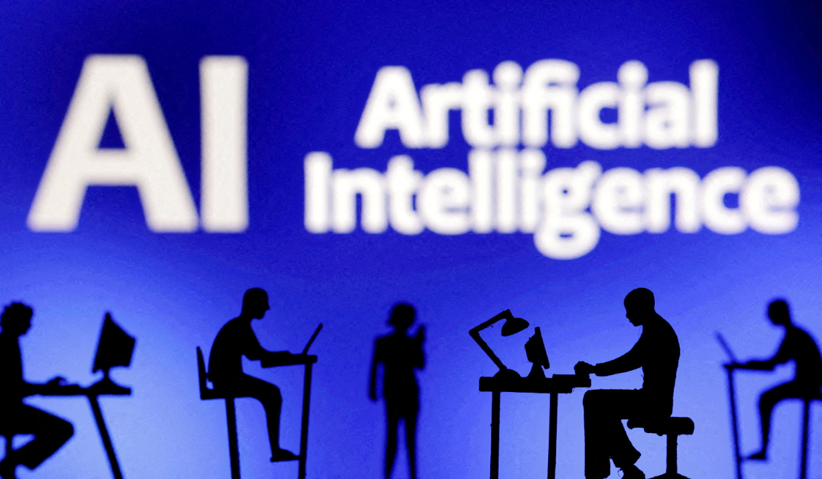 Figurines with computers and smartphones are seen in front of the words "Artificial Intelligence AI" in this illustration created on February 19, 2024. (REUTERS)