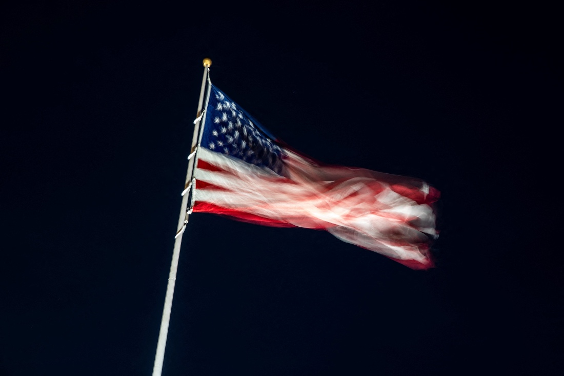 An American flag flutters on the South Lawn ahead of U.S. President Donald Trump's arrival at the White House. (Reuters)