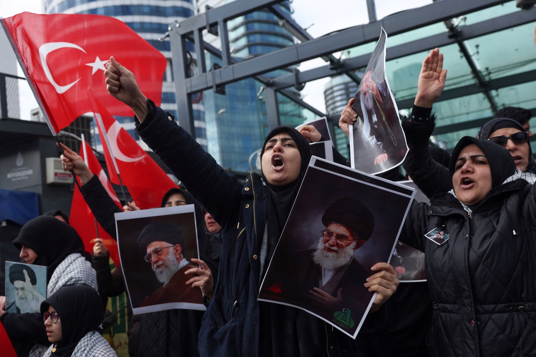 Demonstrators holding posters of late Iran's Supreme Leader Ayatollah Ali Khamenei shout slogans during a protest in Istanbul, Turkiye. (Reuters)