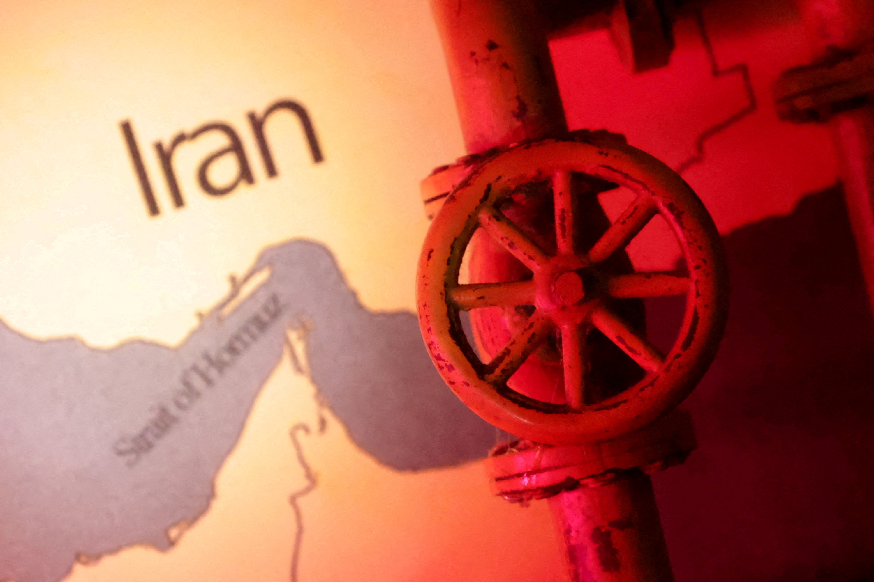 Illustration shows map showing the Strait of Hormuz, Iran and 3D printed oil pipeline. Reuters