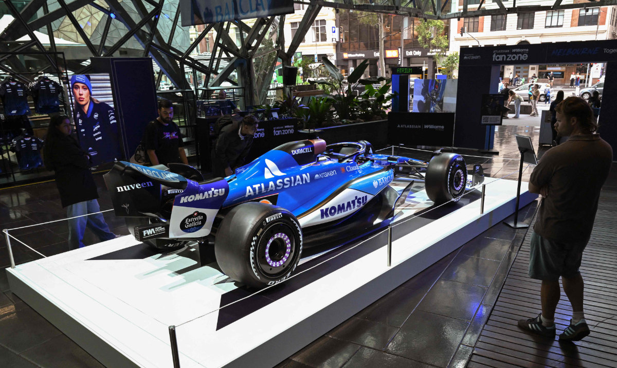 People walk through a Williams F1 team fan zone in Melbourne's central business district on March 2, 2026, ahead of the season-opening Australian Formula One Grand Prix. (AFP)