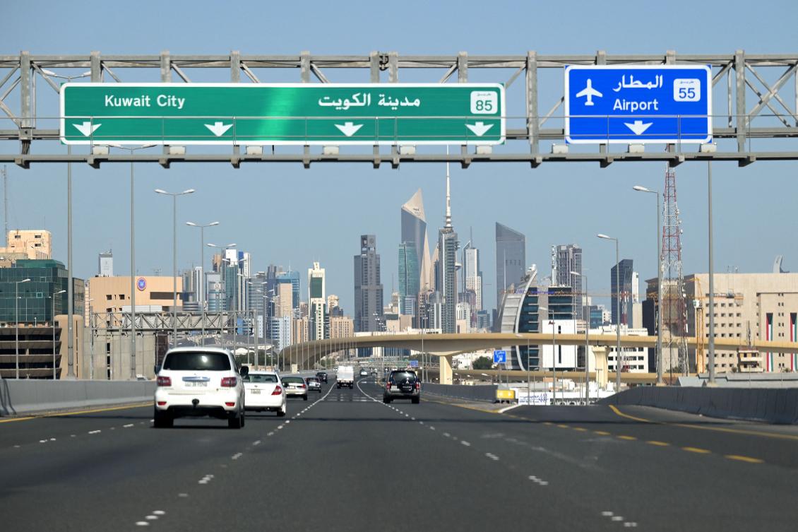 Vehicles drive along the highway leading to and from Kuwait City on March 2, 2026. (AFP)
