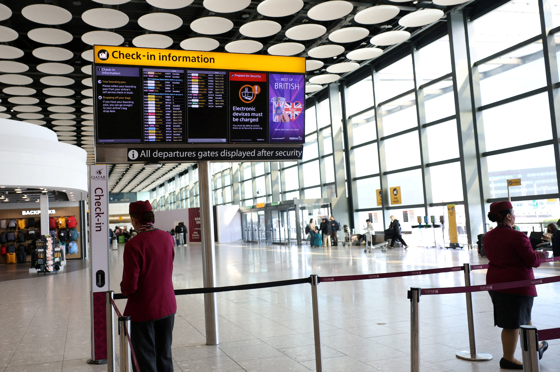 FILE PHOTO: Qatar airline staff stand by a departure board displaying cancelled flights to Middle East countries amid the US-Israel conflict with Iran, at Heathrow Airport Terminal 4, in Greater London, Britain, March 2, 2026. (Reuters)