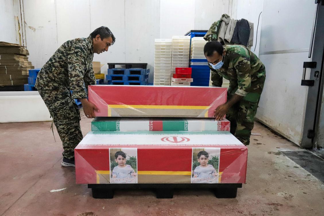 In this picture obtained from Iran’s ISNA news agency, mourners prepare the coffins of children who were killed in a reported strike on a primary school in Iran’s Hormozgan province for a funeral in Minab on Mar. 3, 2026. (AFP)