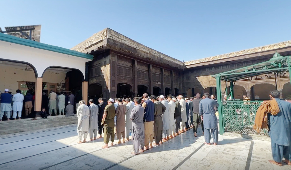 Men pray in the courtyard of Baba Jee Mosque in northwest pakistan. (AN photo)