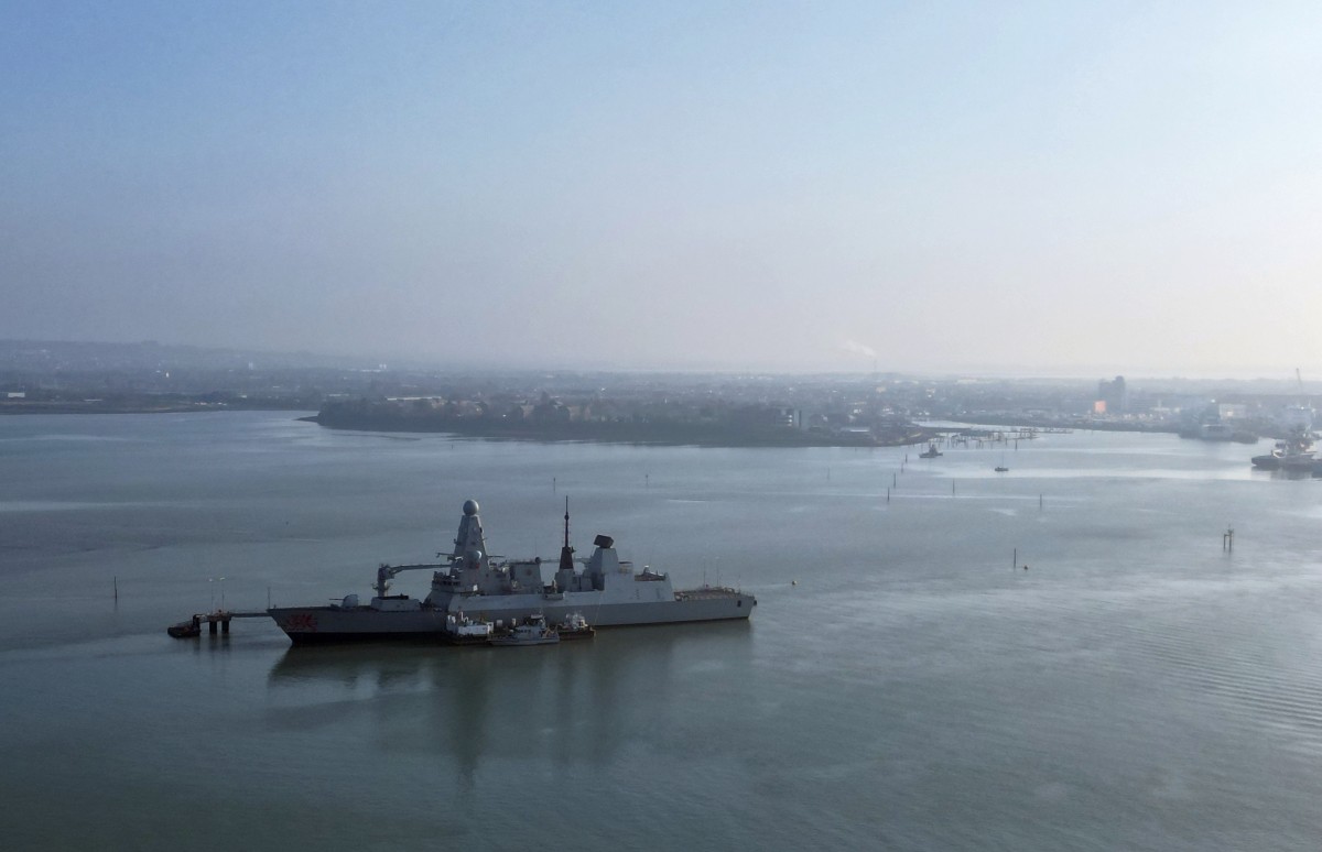 An aerial view shows HMS Dragon, a Royal Navy Type 45 Daring-class air-defence destroyer warship, moored at the HMNB Portsmouth Upper Harbour Ammunition Facility, outside HM Naval Base Portsmouth, pictured from Gosport, on the south coast of England, March 4, 2026. (AFP)