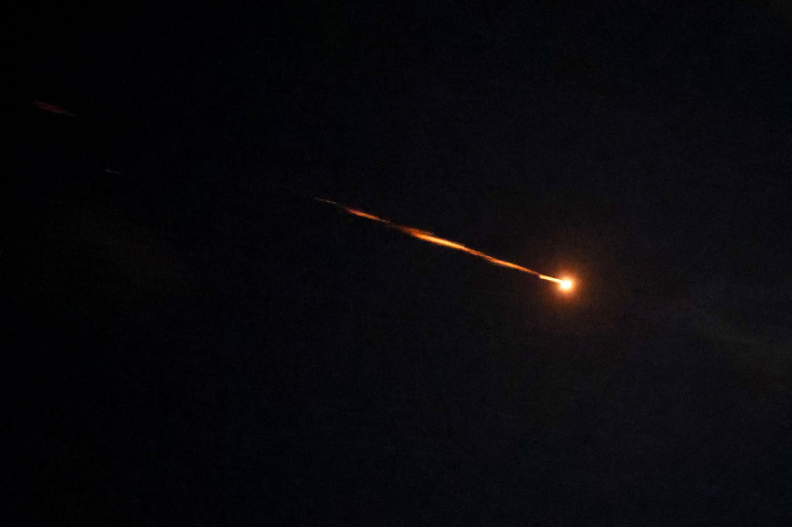 Rocket trails are seen in the sky above the Israeli coastal city of Netanya amid a fresh barrage of Iranian missile attacks on March 5, 2026. (AFP)