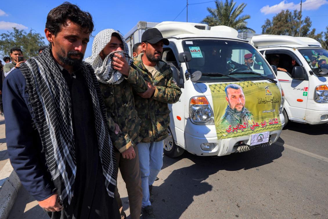 Mourners react during a procession for slain members of Iraq's pro-Iran paramilitary group Hezbollah Brigades (Kataeb Hezbollah) who were killed in a US-Israeli airstrike on their headquarters in al-Qaim near the border with Syria, at the funeral ceremony in Baghdad on March 2, 2026. (File/AFP)