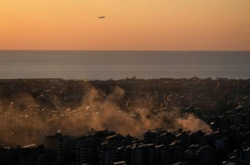A plane takes off from the Beirut Rafic Hariri International Airport as smoke from an earlier Israeli airstrike still rises in Dahiyeh, Beirut’s southern suburbs, Mar. 5, 2026.(AP)