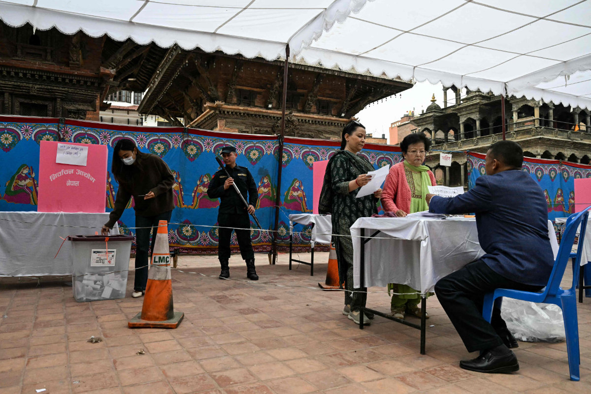 Voters cast their ballot at a polling station during Nepal's general election in Lalitpur on March 5, 2026. (AFP)