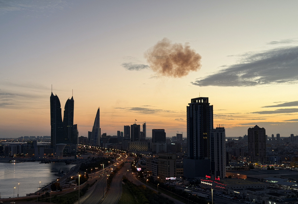 Smoke rises after an Iranian drone was intercepted over the Bahrain Financial Harbour towers in Manama on Friday. (Reuters)