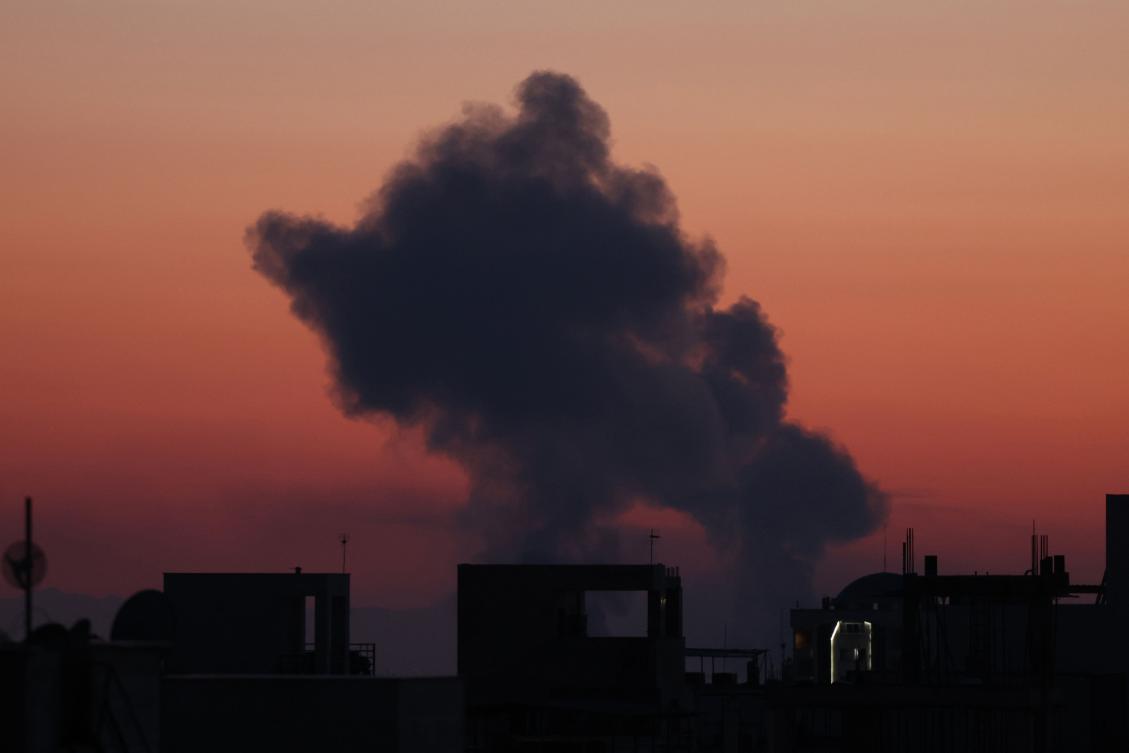 The sun sets as a black plume of smoke ascends from the site of an airstrikes in a central area of the Iranian capital Tehran on Mar. 6, 2026. (AFP)
