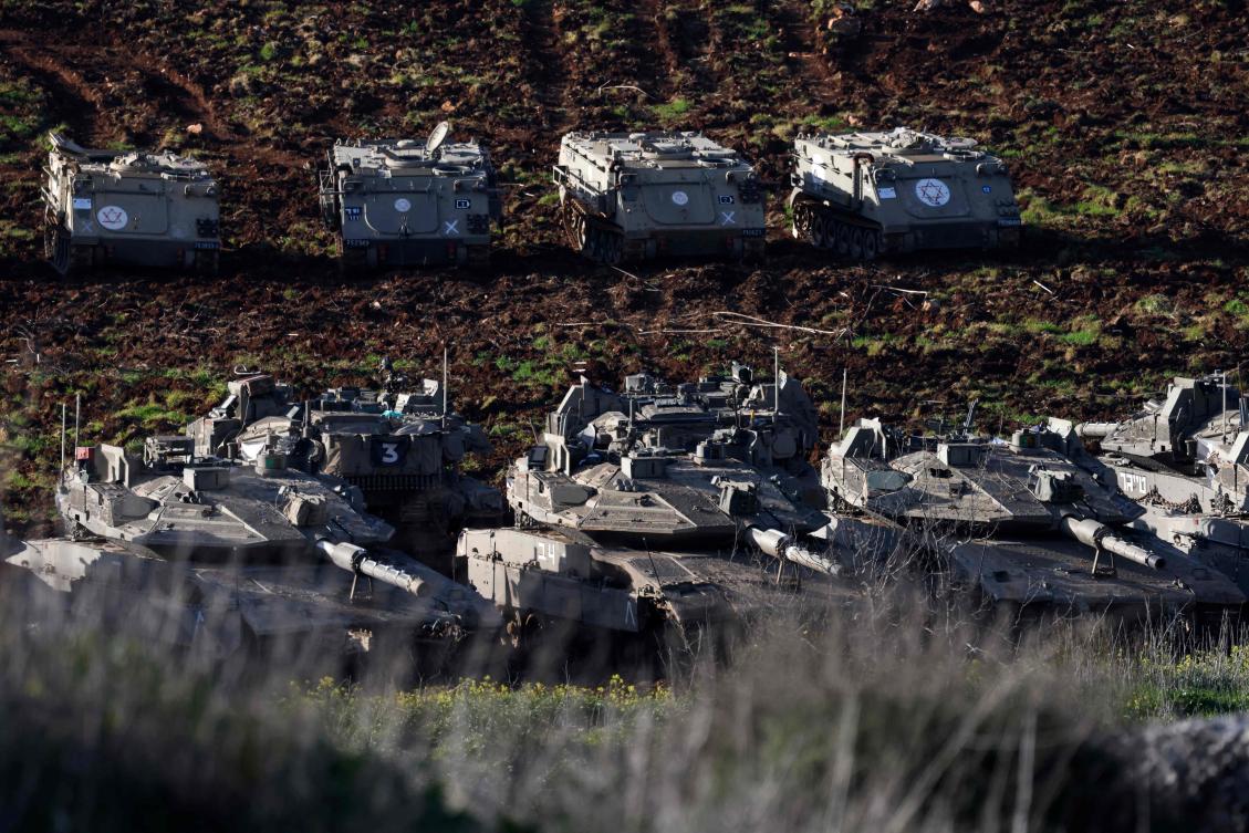 Above, Israeli tanks gather in the upper Galilee near the Israel-Lebanon border on March 6, 2026. Israeli forces earlier attempted a landing operation along the Lebanon-Syria border. (AFP)