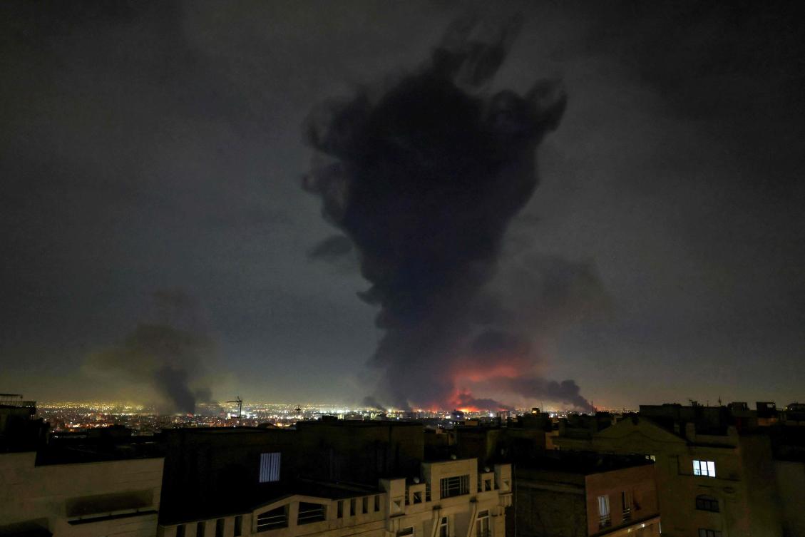 Smoke rises from the Mehrabad International Airport on March 7, 2026 after Israel said it had launched “broad-scale” strikes on targets in Tehran. (AFP)