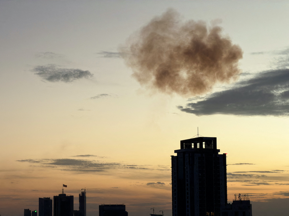 Smoke rises after an Iranian drone was intercepted in Manama on Friday. (Reuters)