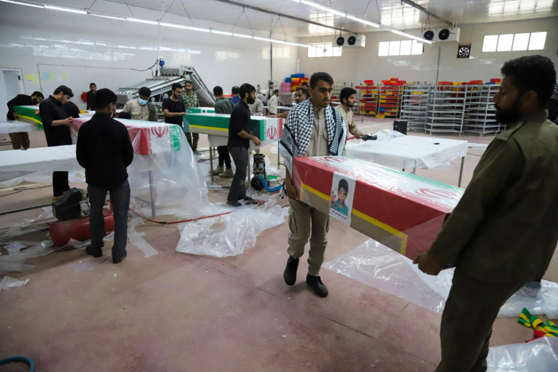 In this picture obtained from Iran’s ISNA news agency, mourners prepare the coffins of children who were killed in a strike on a primary school in Iran’s Hormozgan province for a funeral in Minab on March 3, 2026. (AFP)