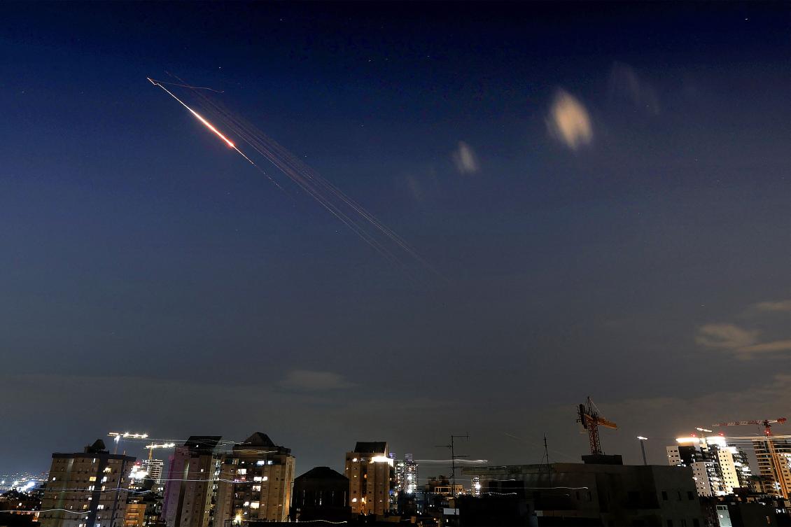 Above, rocket trails are seen in the sky above Netanya on March 7, 2026. Iran said it could fight an intense war for six months against the United States and Israel. (AFP)