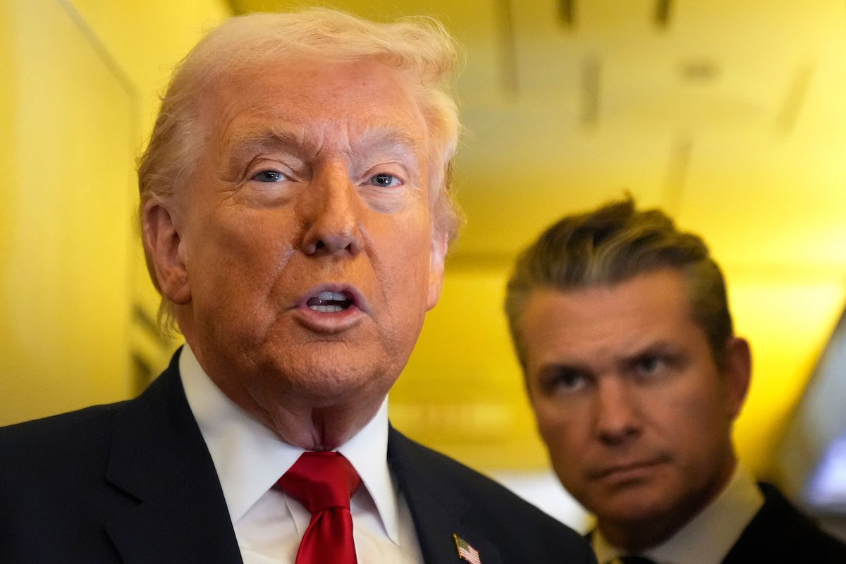 Above, US President Donald Trump speaks to reporters as Defense Secretary Pete Hegseth listens while traveling aboard Air Force One on March 7, 2026. (AP)