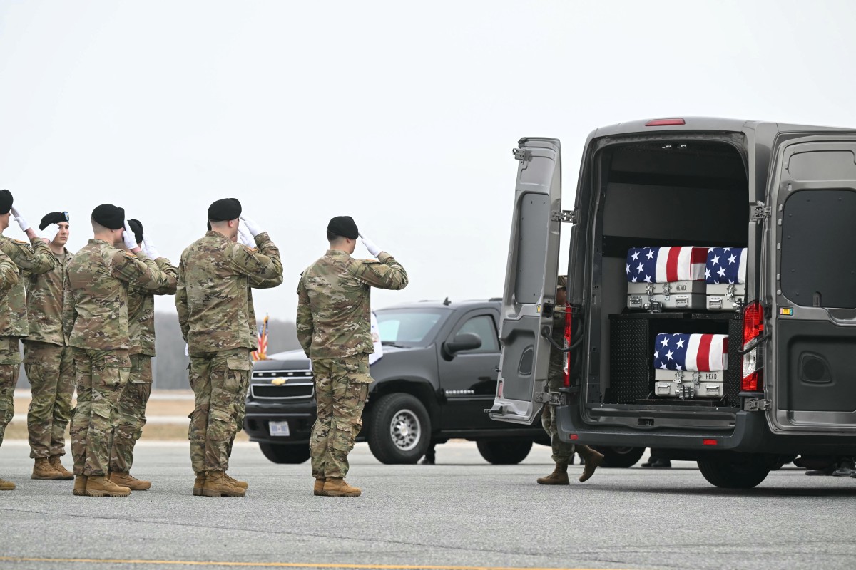 US Army team salutes the flag-draped transfer cases containing the remains of six US soldiers during a dignified transfer solemn event at Dover Air Force Base, in Dover, Delaware, March 7, 2026. (AFP)