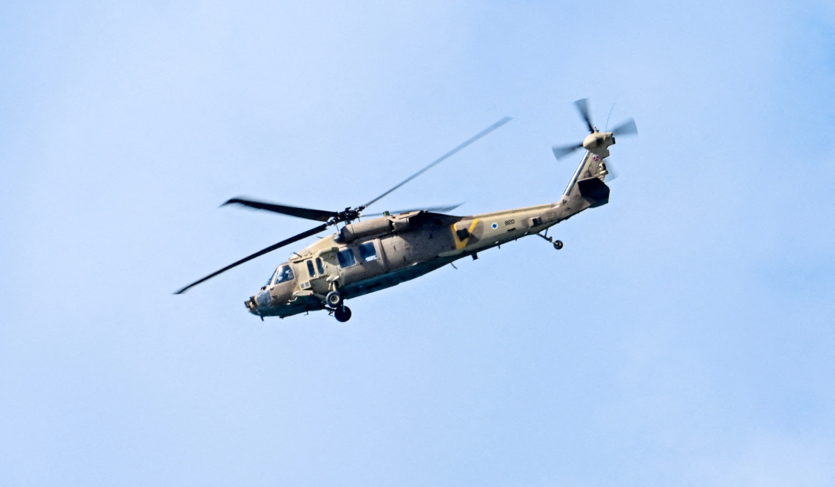 A Black Hawk helicopter flies over the coastline, amid the U.S.-Israeli conflict with Iran, as seen from Tel Aviv, Israel, March 8, 2026. (REUTERS)