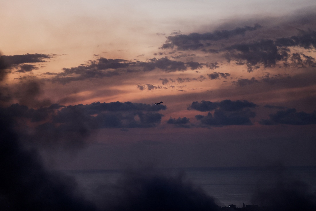 An aircraft flies over Beirut, following an escalation between Hezbollah and Israel, in Lebanon. (Reuters)
