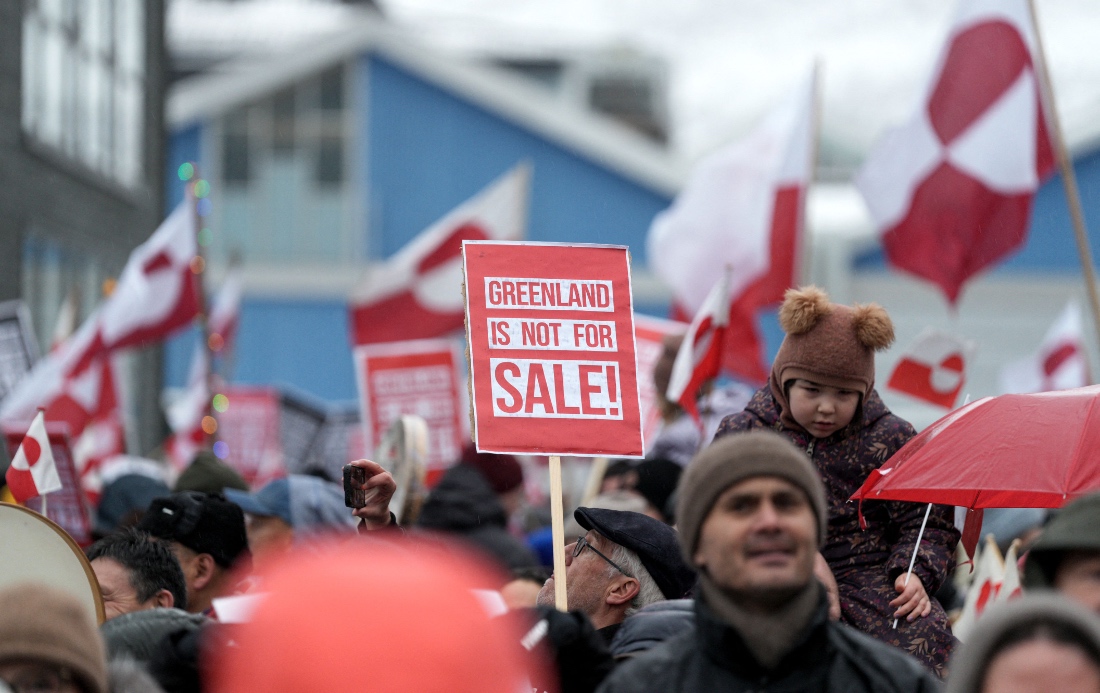 People wave Greenlandic flags as they take part in a demonstration to protest against the US President's plans to take Greenland, in Nuuk, Greenland. (AFP)
