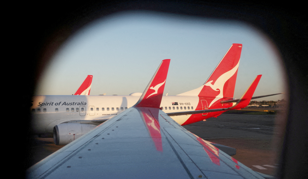 A Qantas logo is visible on the tail of an aeroplane at an airport in Sydney, Australia, September 18, 2025. (REUTERS)