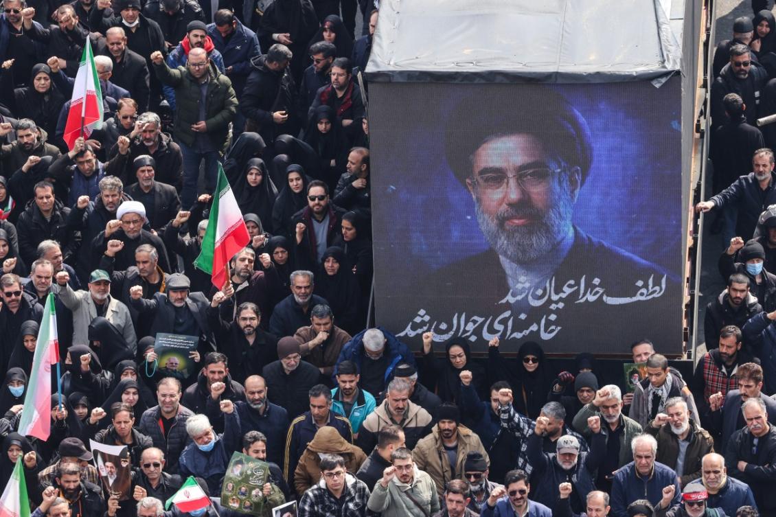 A screen displays a portrait of Iran's new supreme leader Mojtaba Khamenei during the funerals of Iran's Revolutionary Guards Corps (IRGC) commanders, army commanders and others killed in the early days of the United States and Israeli strikes on Iran, at Enghelab Square in Tehran on March 11, 2026. (File/AFP)