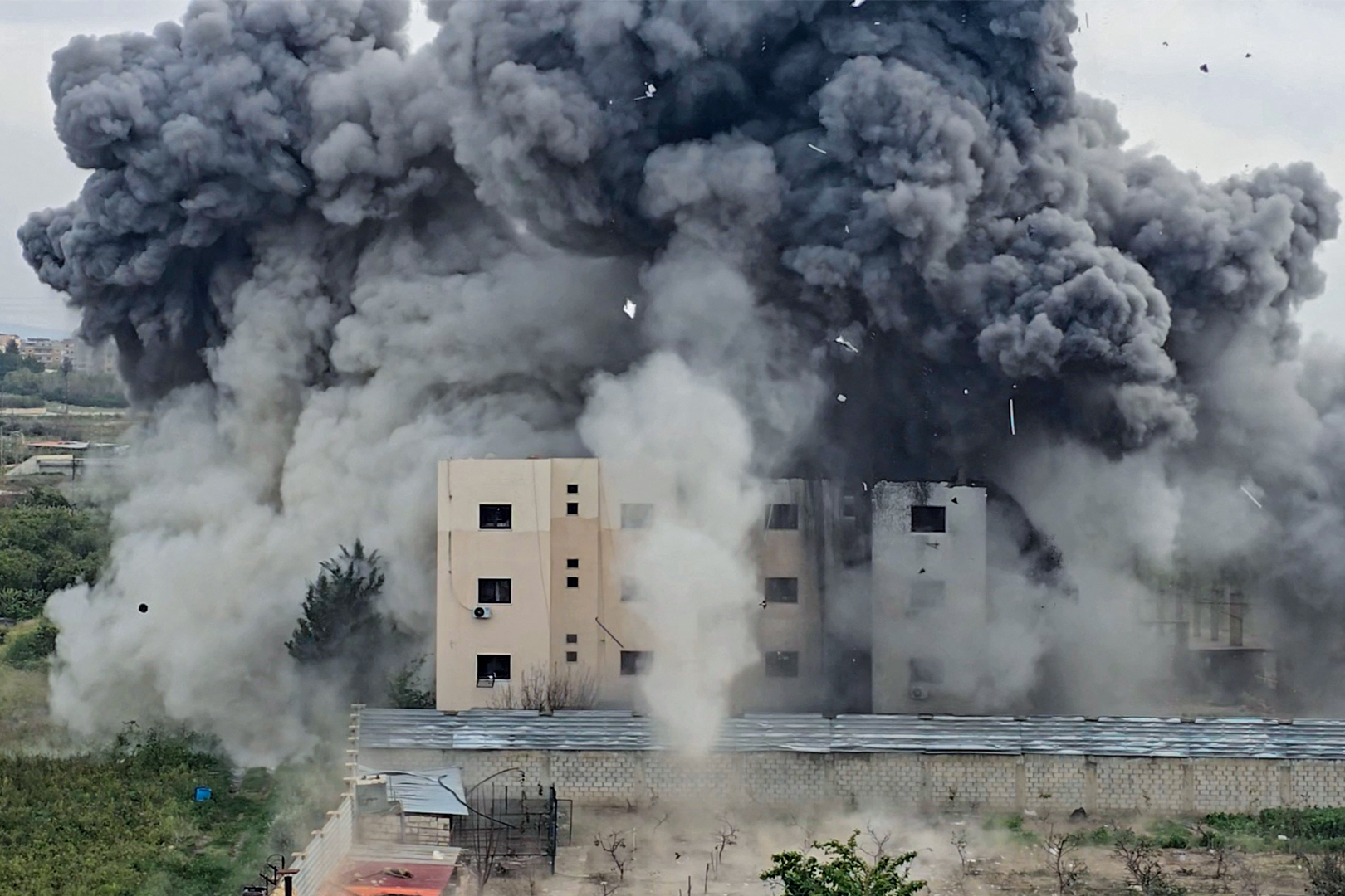 Smoke rises from the site of an Israeli airstrike that targeted a building in the southern Lebanese village of Abbasiyyeh on March 13, 2026. (AFP)