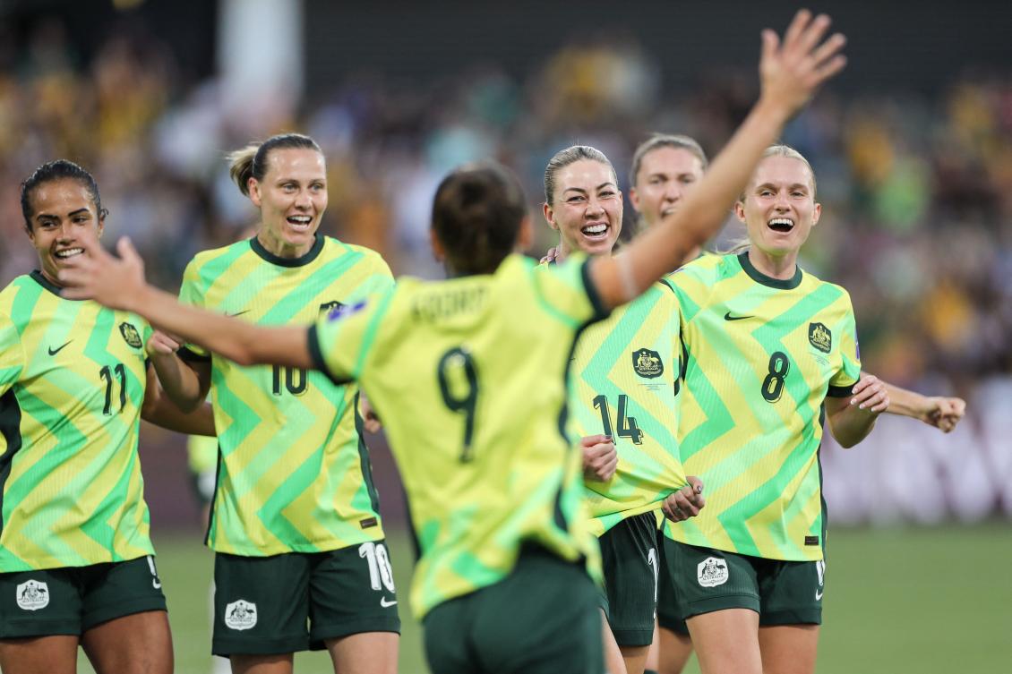 Australia’s Alanna Kennedy (14) celebrates with teammates after scoring a goal during their AFC Women’s Asian Cup Australia 2026 match against North Korea in Perth on Mar. 13, 2026. (AFP)
