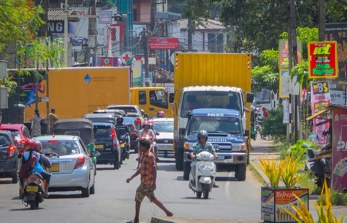 A police van escorts cold storage vehicles carrying bodies of Iranian sailors to an airport in Galle, Sri Lanka. The bodies are the victims of a US submarine attack on Iranian military ship IRIS Dena. (Reuters)