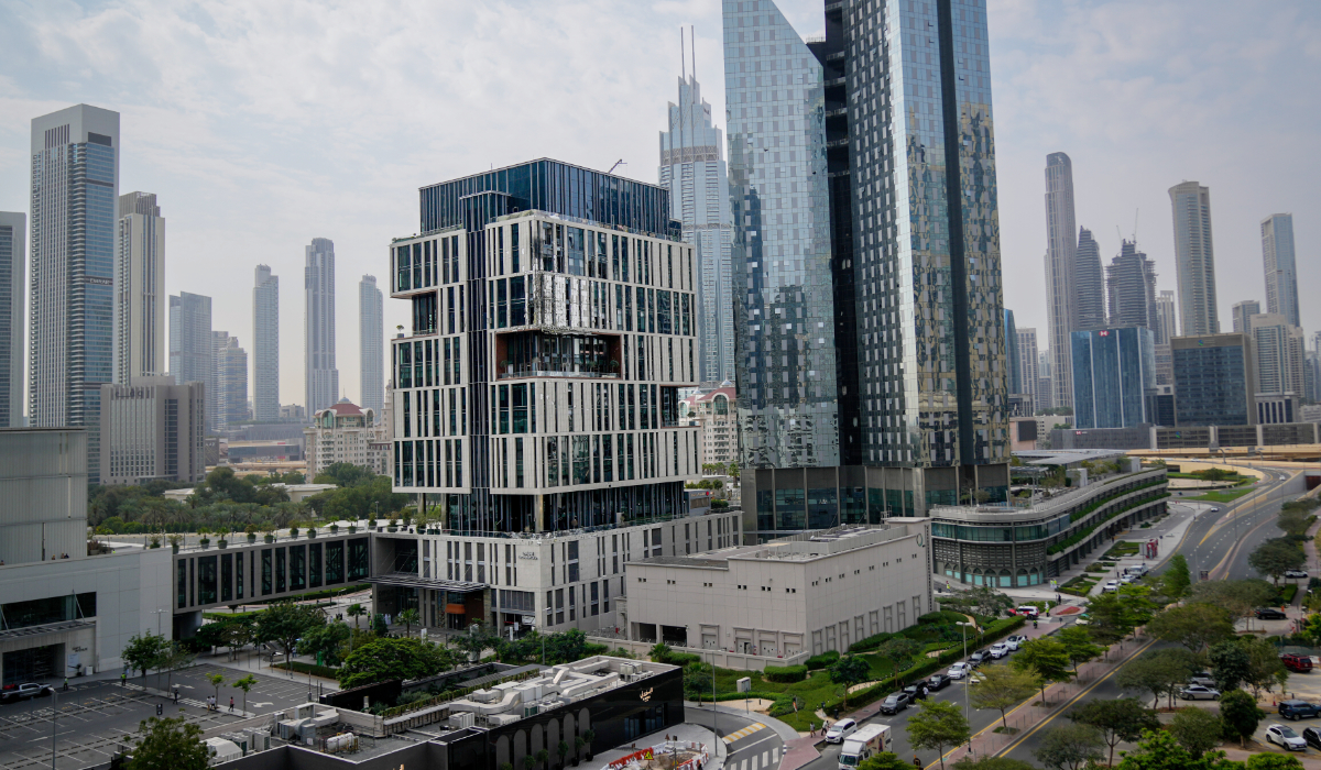 Facade of a building at Dubai's financial district is seen partially damaged which, according to the authorities was caused by falling debris after a successful interception, United Arab Emirates, Friday, March 13, 2026. (AP)