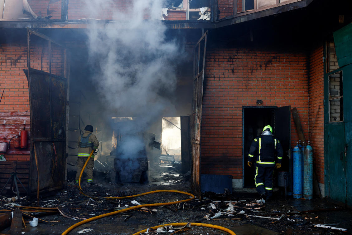 Firefighters work at a warehouse and production facility at the site of a Russian missile and drone strike in the town of Brovary, Kyiv region, Ukraine on March 14, 2026. (Reuters)