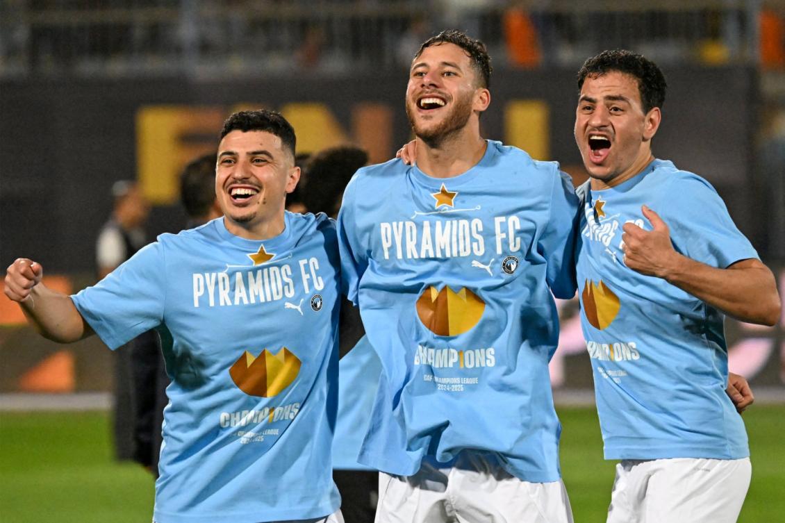 Pyramids' players celebrate after winning the second leg of the CAF Champions League final football match between Pyramids FC and Mamelodi Sundowns at 30 June Stadium in Cairo on June 1, 2025. (Photo by Khaled DESOUKI / AFP)