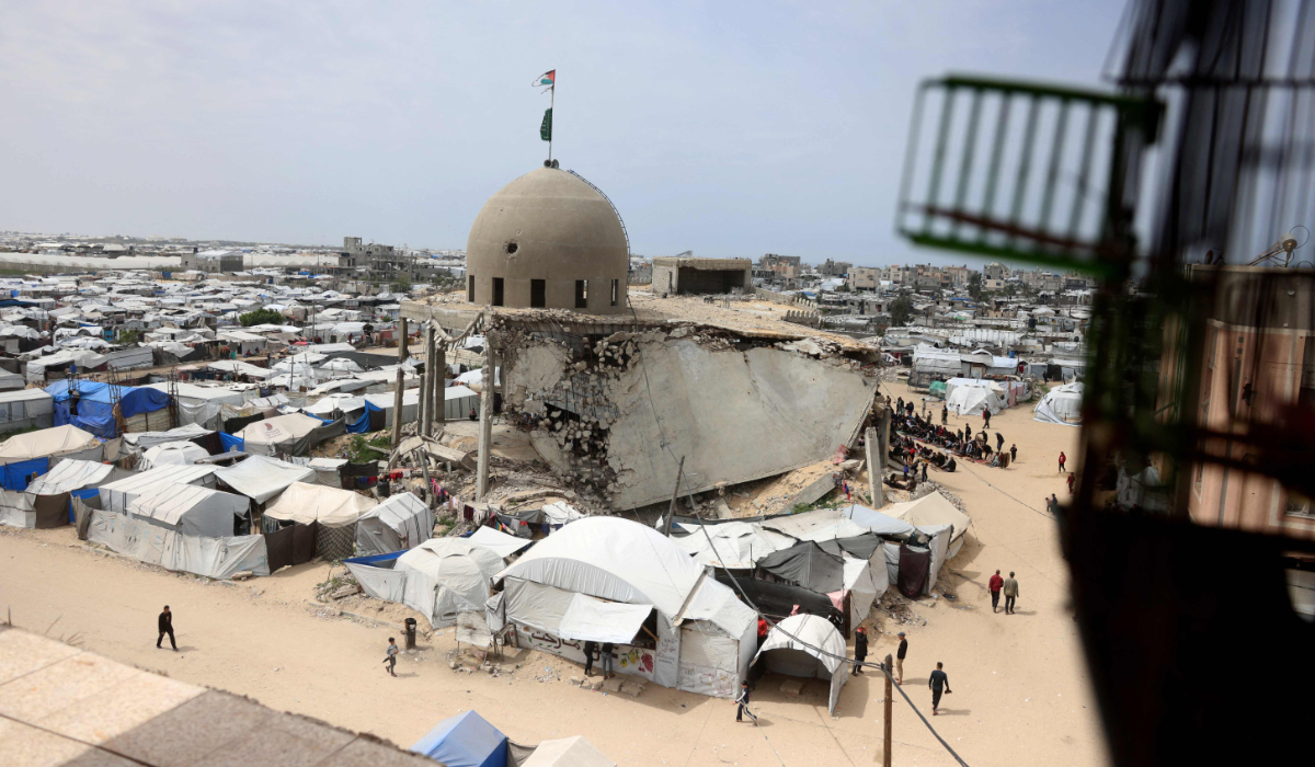 Mourners attend the funeral of Palestinians killed in an overnight Israeli strike, according to medics, at Nasser Hospital in Khan Younis, in the southern Gaza Strip, March 14, 2026. (REUTERS)