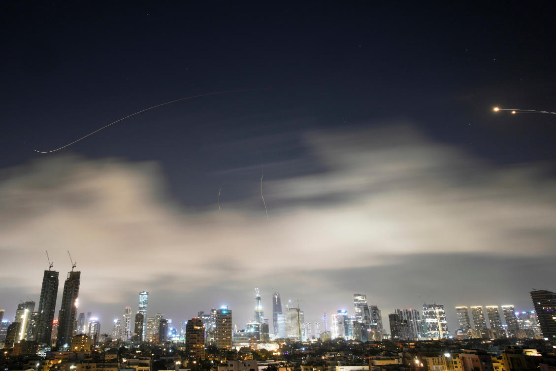 Israeli air defense system fires to intercept missiles during an Iranian attack over Tel Aviv, Israel early on March 15, 2026. (AP)