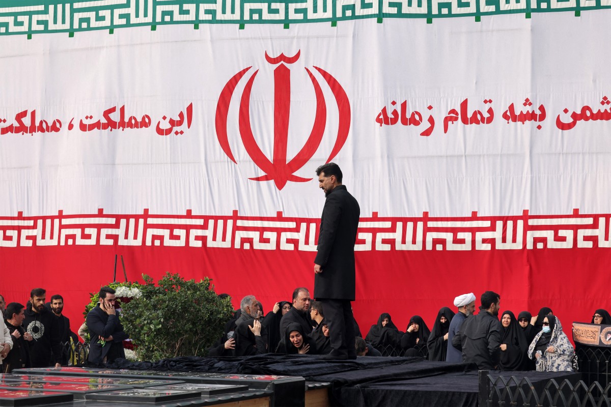 Family members and relatives of Ali Shamkhani, gather during his funeral at the Imamzadeh Saleh shrine in northern Tehran, Iran. (AFP)