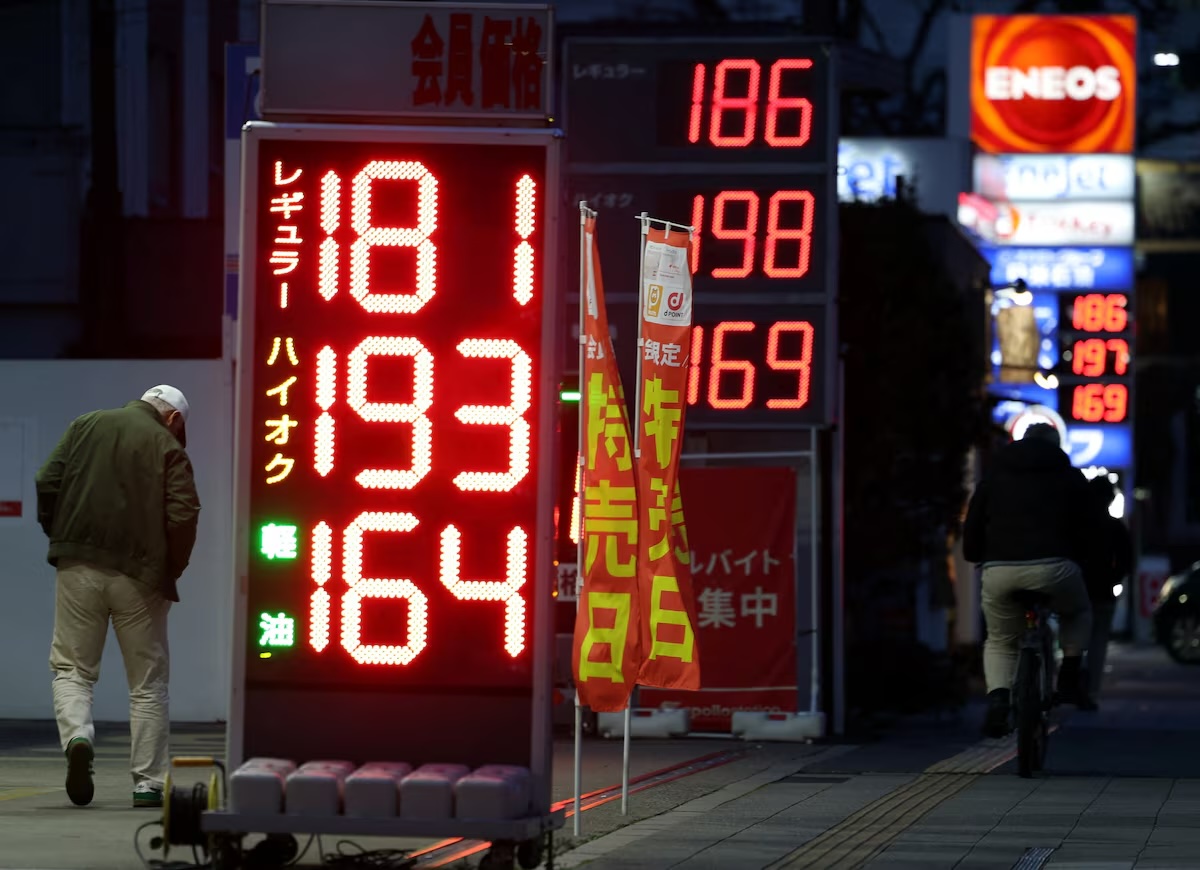 Signboards display fuel prices outside gas stations, amid the US-Israel conflict with Iran, in Tokyo, Japan March 13, 2026. REUTERS/Issei Kato