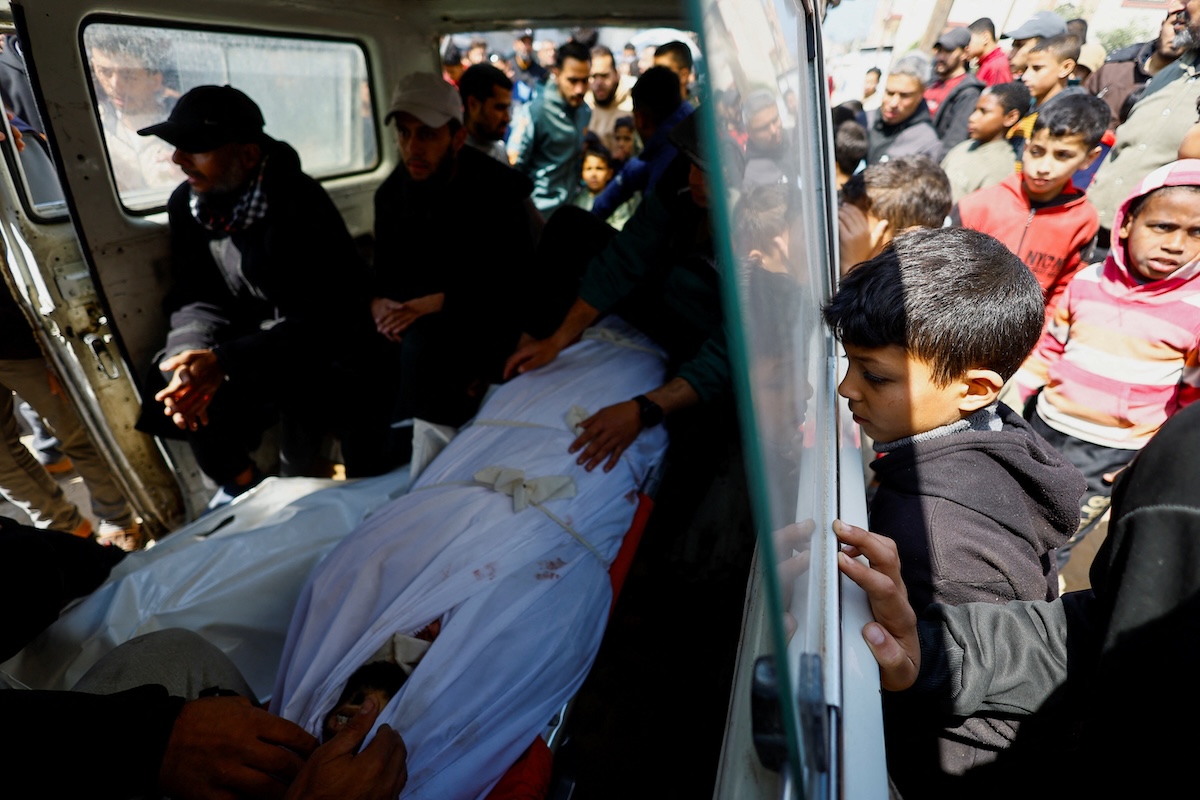 Mourners attend the funeral of Palestinians killed in an Israeli strike on a house, according to medics, in Nuseirat in the central Gaza Strip on March 15, 2026. (Reuters)