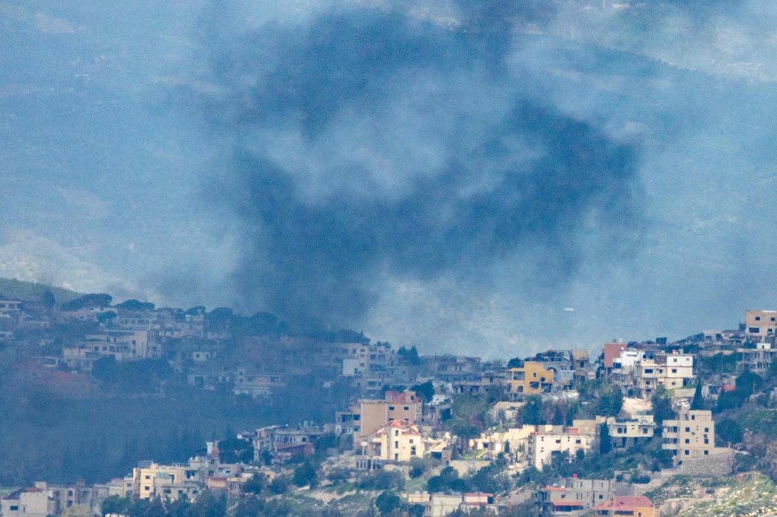 Smoke rises from the Lebanese village of Khiam after an Israeli strike as seen from the Upper Galilee in northern Israel on March 16, 2026. (AFP)