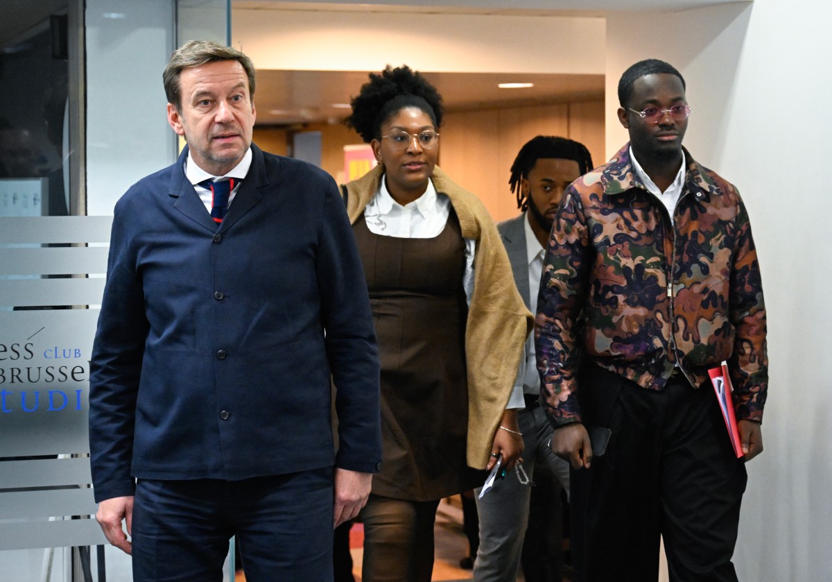 Belgian lawyer Christophe Marchand and family members of murdered Congolese independence icon Patrice Lumumba Yema Lumumba and Mehdi Lumumba, arrive for a press conference following a hearing before a Belgian court. (AFP)