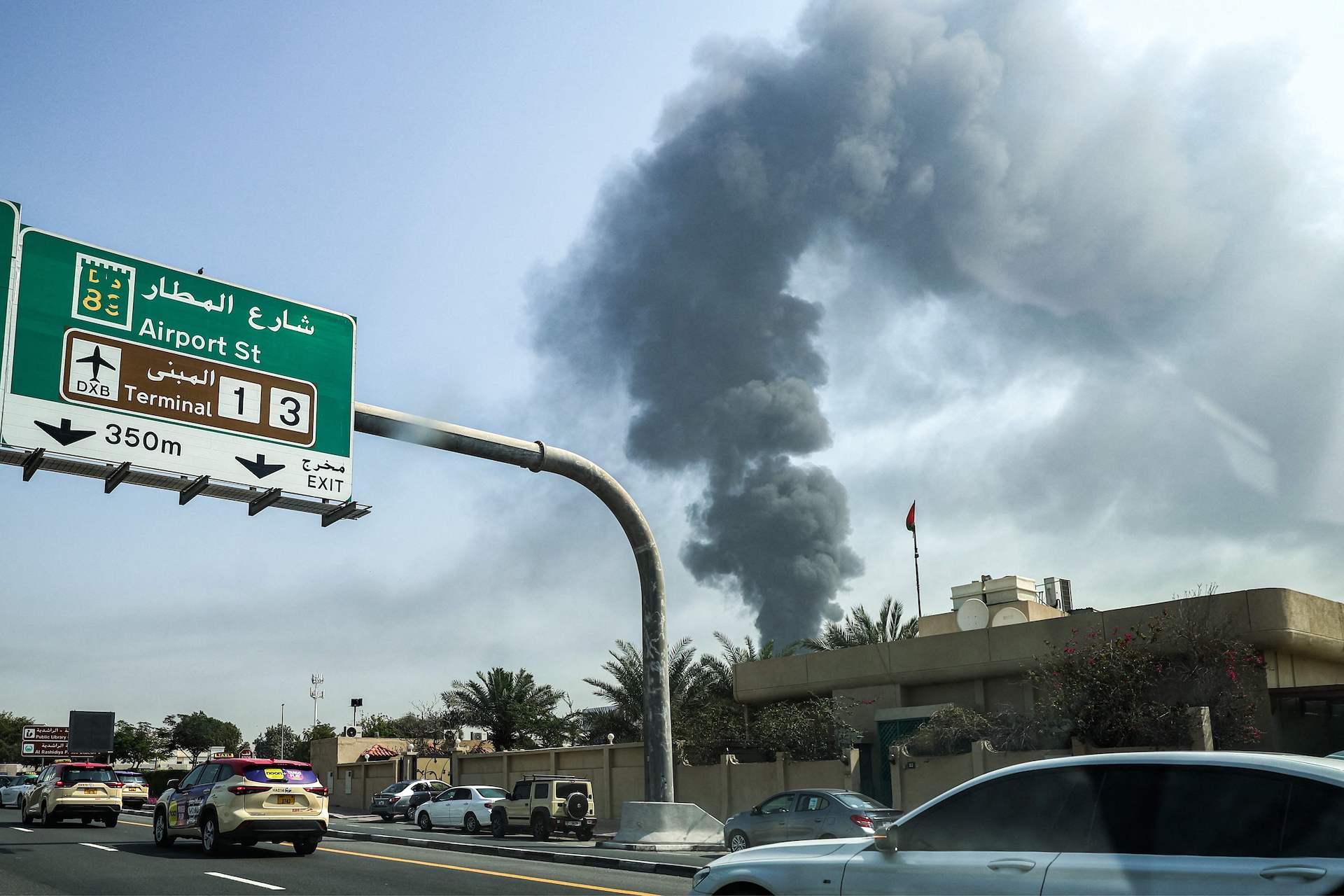 A smoke plume rises from an ongoing fire at Dubai International Airport in Dubai on March 16, 2026. (AFP)
