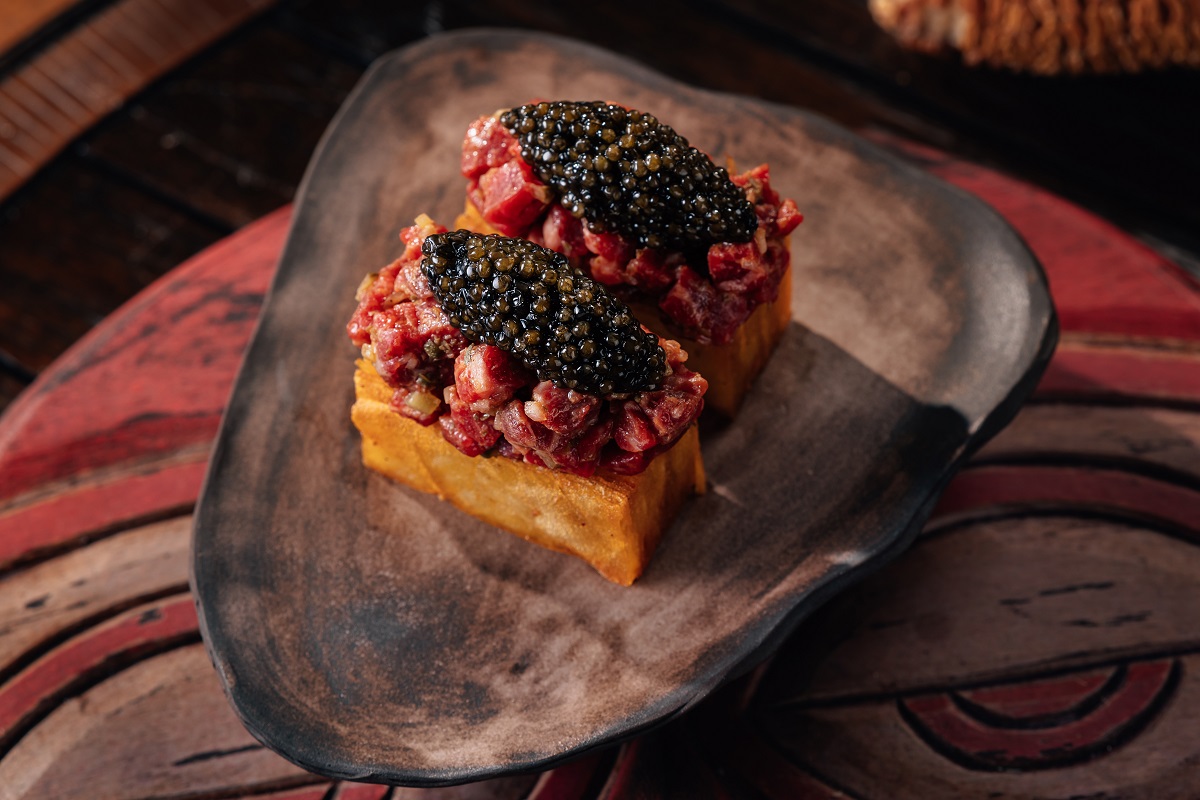 Served as a small plate for two, the dish pairs delicate tartare with a rich, crisp potato gratin.